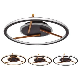 Close-up of a modern circular ceiling light with interlocking rings and copper rods